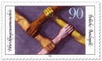 Stamp: Hände greifen Arme - Entwicklungszusammenarbeit