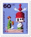 Briefmarke: Holzspielzeug: Frau am Taubenhaus