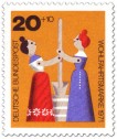 Briefmarke: Holzspielzeug: Frauen am Butterfass