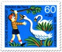 Briefmarke: Junge ärgert Schwäne am See