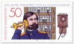 Briefmarke: Altes Telefon (Fernsprecher) und Vermittlungsbeamter